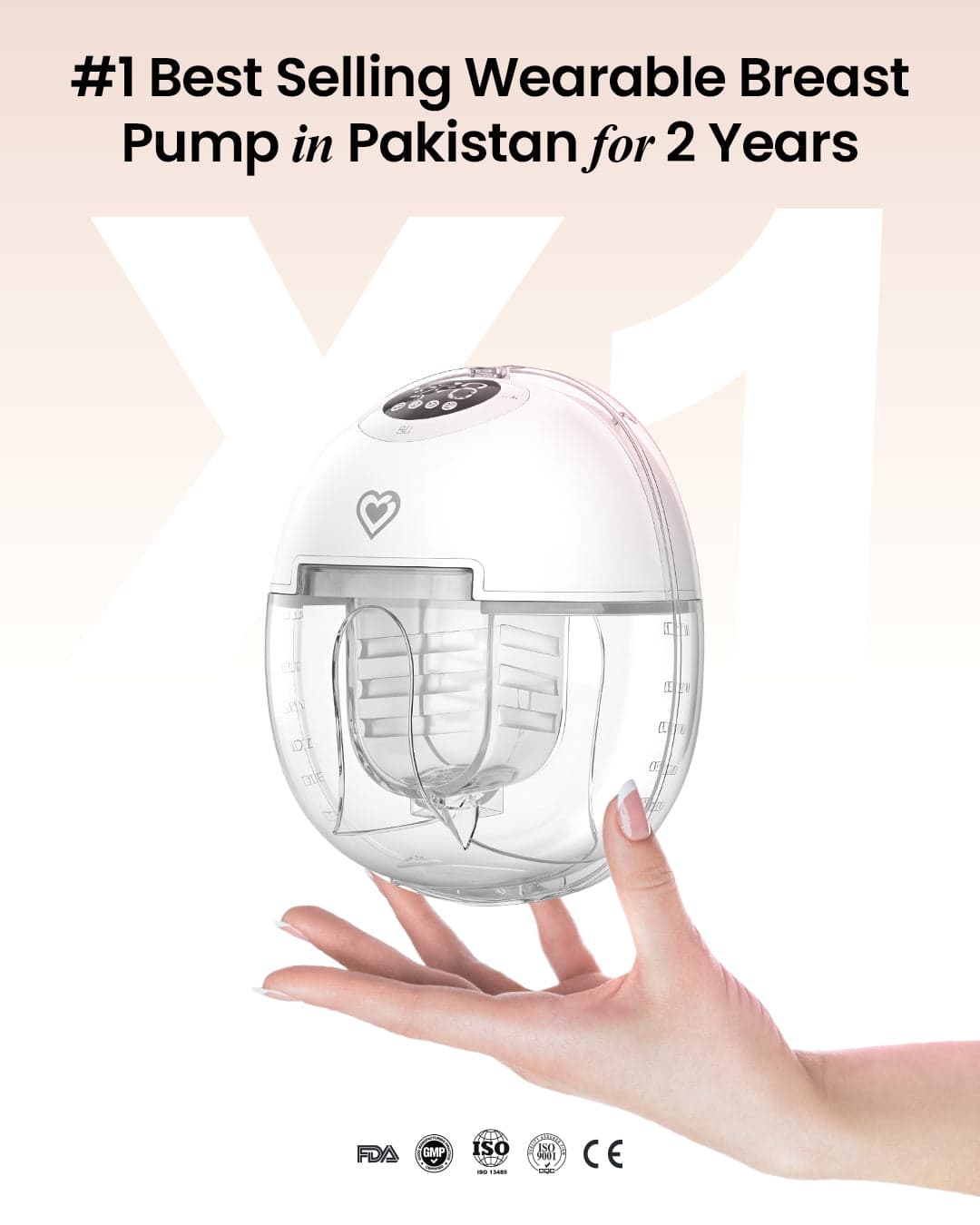 MomSolutions wearable breast pump held in hand